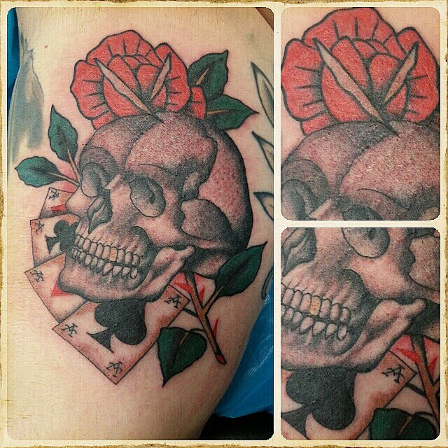 Skull, aces and Rose,  bloody and swollen. 
when is healed i will upload a reall
